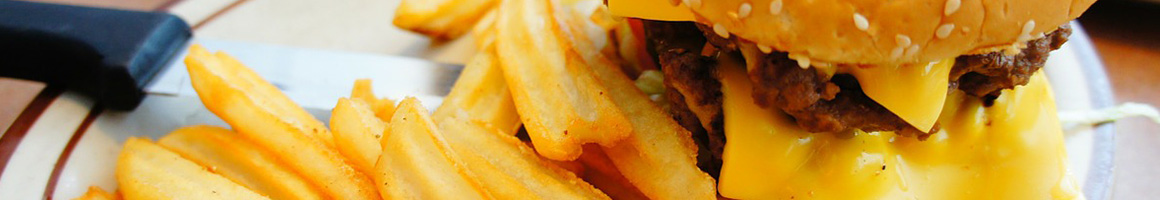 Eating American (Traditional) Burger at Herd's Burgers restaurant in Jacksboro, TX.
